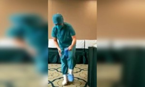 করোনা থেকে বাঁচার জন্য স্বাস্থ্যকর্মীদের কি পোশাক পড়তে হয় দেখুন